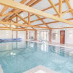 Enjoy a swim in the heated indoor pool at Wash Farm Holidays